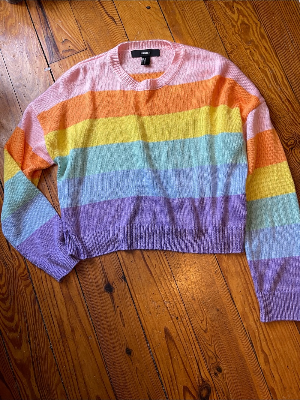 Cute slightly cropped rainbow sweater size medium. Excellent condition